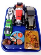 A tray of die cast cars, tin plated money box,