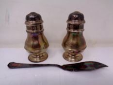 A pair of silver salt and pepper pots, London 1904,
