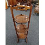 An Edwardian mahogany cake stand