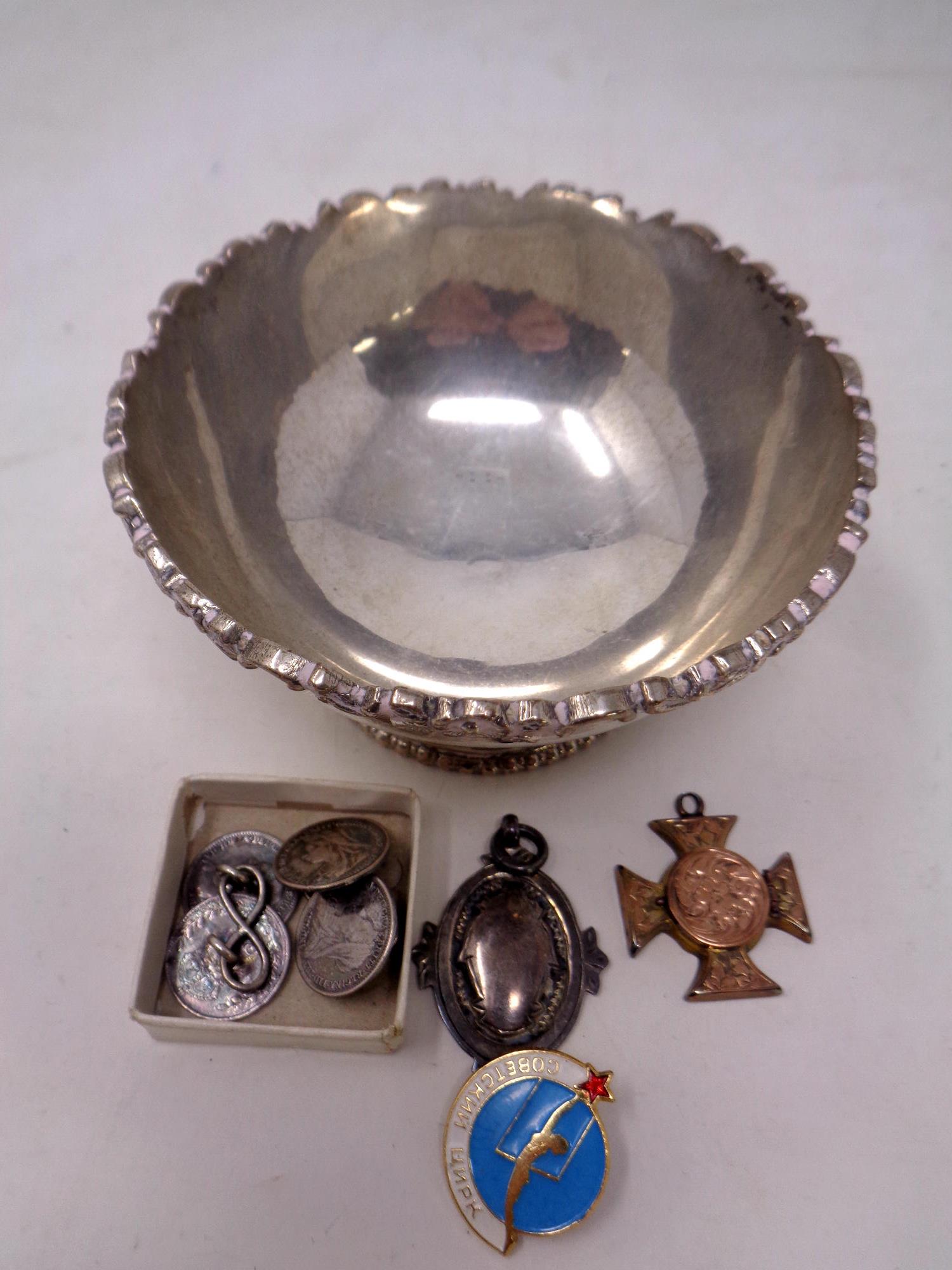 A bowl stamped 'Silver', width 9 cm, together with a silver fob, coin cuff links,