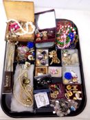 A tray of costume jewellery, charm bracelets, continental coin bracelet,