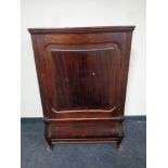 A continental mahogany cabinet (locked)