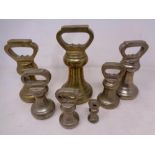 A set of seven 19th century graduated brass weights
