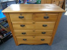 An Edwardian satinwood five drawer chest