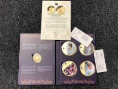 A set of four gold plated collectors coins commemorating Princess Diana together with a further