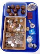 A tray of antique wooden carpet bowls, pre decimal and later coins, compass, desk clock.