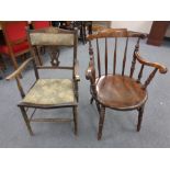 A 19th century spindle backed armchair (as found) together with a further armchair in floral fabric