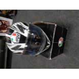An AGU motorcycle helmet in box