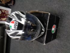An AGU motorcycle helmet in box