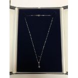 A 9ct white gold diamond and blue topaz pendant on chain CONDITION REPORT: 1.