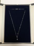 A 9ct white gold diamond and blue topaz pendant on chain CONDITION REPORT: 1.