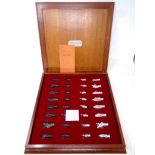 A cast pewter Camelot chess set by Royal Selangor in teak box