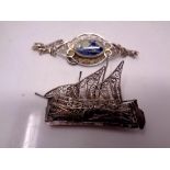 A white metal filigree brooch modelled as a boat,