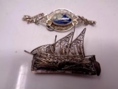 A white metal filigree brooch modelled as a boat,