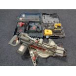 A performance sliding mitre saw together with a Bosch hammer drill and Dewalt drill
