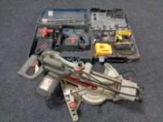 A performance sliding mitre saw together with a Bosch hammer drill and Dewalt drill