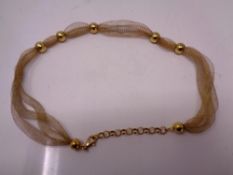 A silver gold plated ball necklace