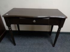 A painted serpentine fronted hall table fitted a drawer