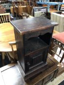 A stained pine bedside cabinet