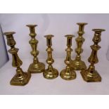 Three pairs of Victorian brass candlesticks