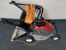 A Honda HRE370 electric lawn mower with grass box