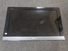 A Sony 32 inch LCD TV with lead and remote (no table stand)