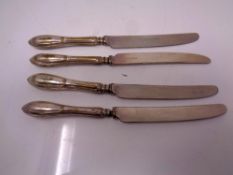 Four silver handled cake knives