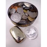 A tin containing English and foreign coins, pre decimal coins, £2 and £5 coins,