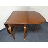 A D-end drop leaf table on cabriole legs,