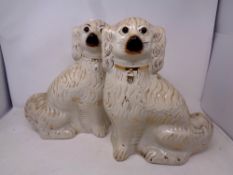 A pair of 19th century Staffordshire spaniels