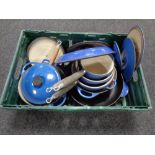 A crate of cast iron Le Creuset lidded pans (blue)