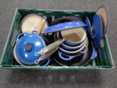 A crate of cast iron Le Creuset lidded pans (blue)