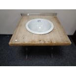 A reclaimed pine sink unit with antique ceramic sink on a cast iron base