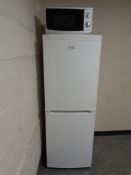 A Beko fridge freezer together with a microwave