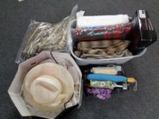 A box of umbrellas, together with formal hats, plastic tub containing blankets,