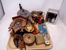 A tray of alcohol miniatures, cuckoo clock, miniature mandolin and violin,