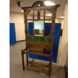 A 19th century oak mirrored tiled hall stand
