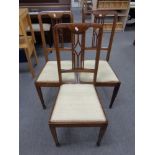 Three Edwardian inlaid mahogany dining chairs