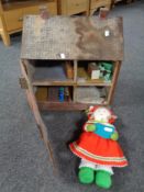 A 20th century dolls house with furniture together with a knitted soft toy