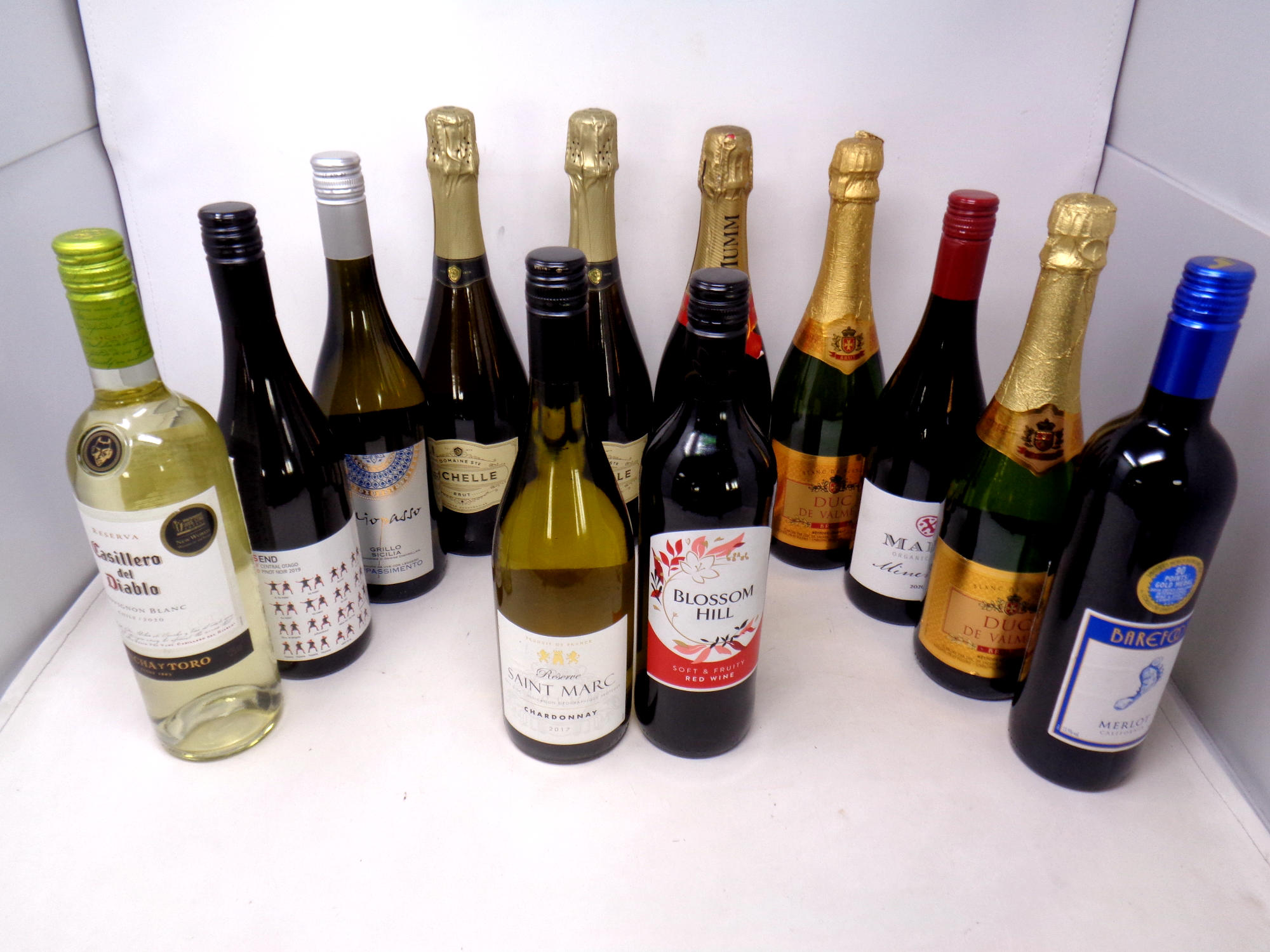 A tray of twelve various bottles of wine : St Marc chardonay, Duc De Valmer,