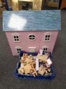 A doll's house together with a box of dolls and furniture