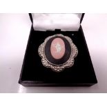 A hallmarked Chester 1948 silver and pink Wedgwood Jasper ware brooch (converts to a pendant) with