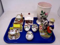 A tray of four Coalport china cottages, three china bird eggs, Maling vase,