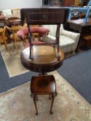 A circular reproduction pedestal drum table on brass capped feet together with a mahogany sofa