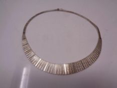 A silver collar necklace