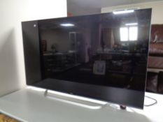 An LG 55 inch LCD TV with LG sound bar and sub woofer,
