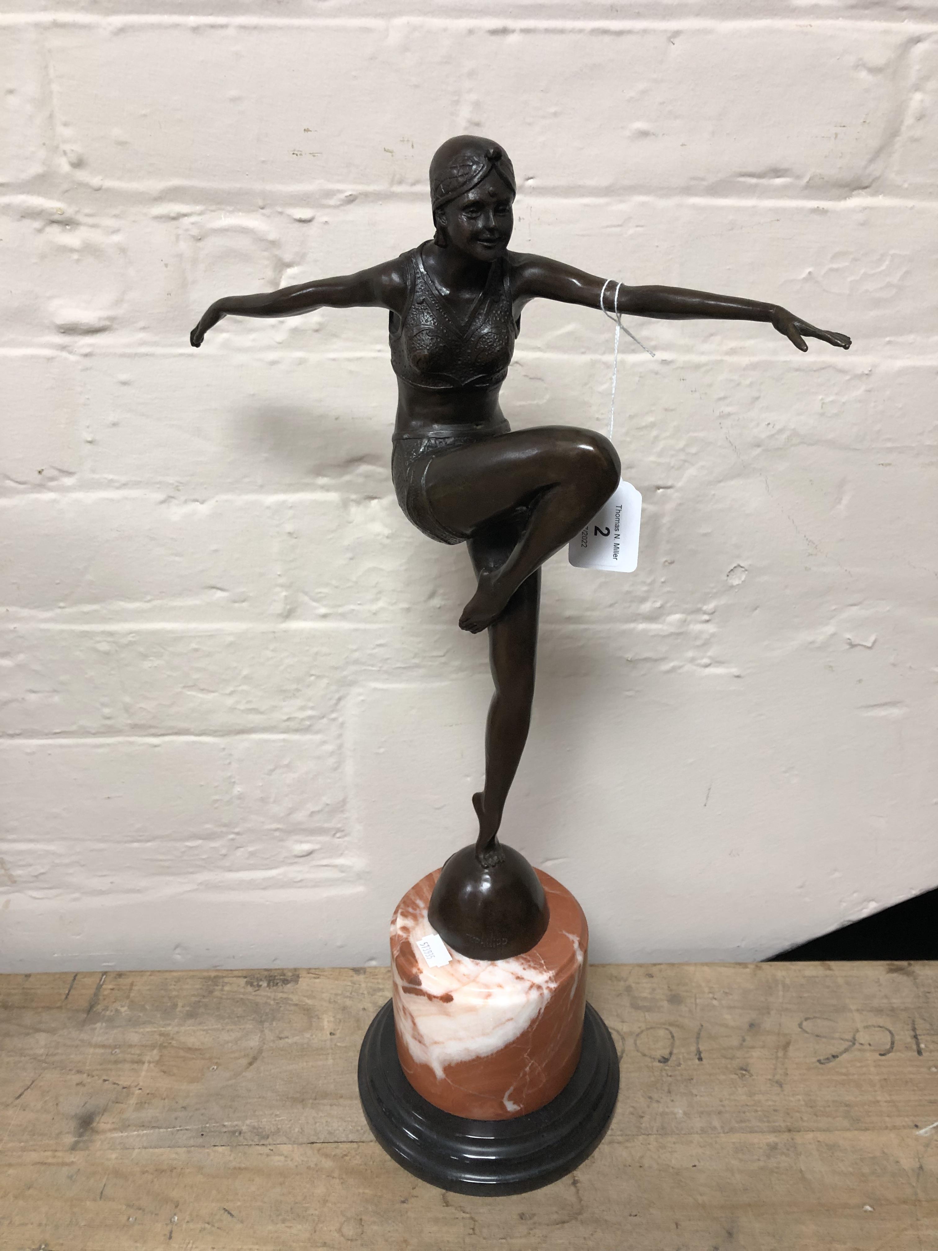 An Art Deco style bronze figure of a dancer on marble and turned wooden plinth, height 56 cm.
