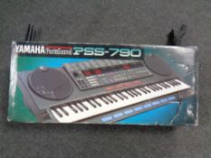 A Yamaha portasound PSS 790 electric keyboard (boxed) with stand,