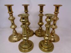 Three pairs of Victorian brass candlesticks