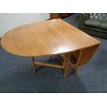 A Nathan teak drop leaf table,